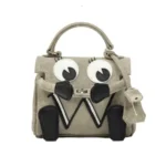 READYMADE x DR Woo Monster Tan Bag Front Look